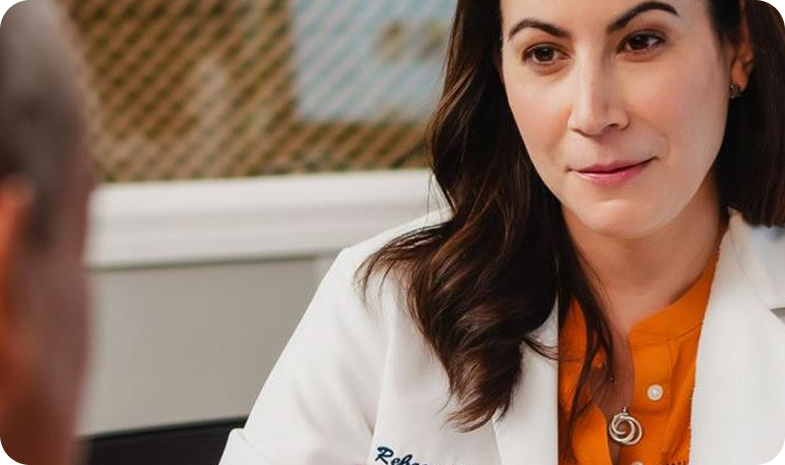 A Beltone hearing specialist consults with a patient after their hearing test.