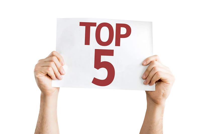 Person holding up a paper with text 