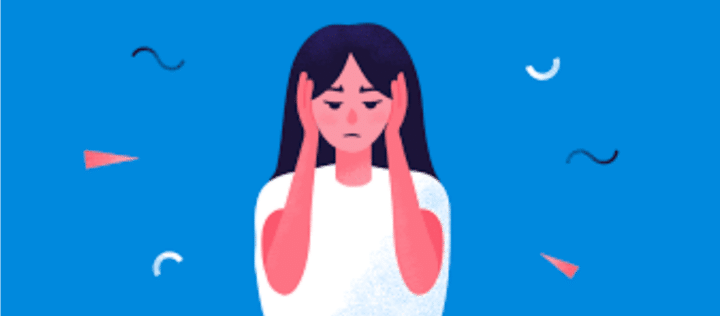 Woman holding her hands over her ears.