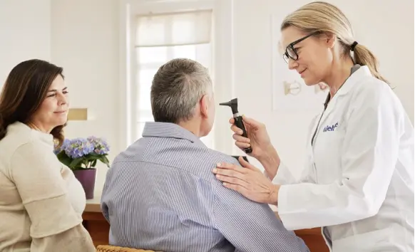 patient getting a hearing test during his appointment